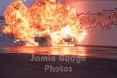 © Jamie Budge, all rights reserved.
STUNT CAR EXPLODES INTO HUGE BALL OF FIRE AS STUNT "STEERER" ROLLS OUT DOOR ON OPPOSIDE SIDE OF CAR.   No Rights Implied by possession of this image.     Contact:
Jamie Budge (310) 453-4808  jamiebudge@windskate.com
