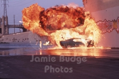 © Jamie Budge, all rights reserved.
FLAMES SUBSIDE AS STUNT "STEERER" DAN GILLEY CRAWLS FROM FLAMES AFTER BAILOUT.
No Rights Implied by possession of this image.     Contact:
Jamie Budge (310) 453-4808  jamiebudge@windskate.com