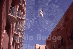 © Jamie Budge, all rights reserved.
"GROOM"( STUNTMAN JEFF WEINKE),  MID FLIGHT IN CHASM BETWEEN TWO HOTEL BUILDING, WHILE "BRIDE" (REALLY HIS SISTER), THROWS BRIDAL BOUQUET ABOVE.
No Rights Implied by possession of this image.     Contact:
Jamie Budge (310) 453-4808  jamiebudge@windskate.com