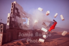 © Jamie Budge, All Rights Reserved.
GREGORY GYETISON IS AIRBORNE AFTER PENETRATING WALL.
NO RIGHTS Implied by posession of this CD.  Contact:
jamiebudge@windskate.com    (310) 453-4808