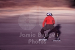 DOWHILL SKATER IN RED © Jamie Budge, all rights reserved.
SIDE SKATER IN RED BELOW CURVES AHEAD SIGN ON OLD TUJUNGA CANYON.