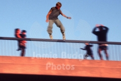 INLINE SKATER RAIL GRINDS BY STARTLED PEDESTRIANS ON PIER © Jamie Budge, all rights reserved.