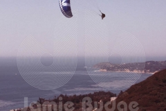 © Jamie Budge, all rights reserved.
CLAUDE FISET POWERS INTO A PARAGLIDING FREESTYLE TURN ABOVE LATIGO POINT IN MALIBU, CALIFORNIA.
No Rights Implied by possession of this image.     Contact:
Jamie Budge (310) 453-4808  jamiebudge@windskate.com