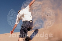 SANDBOARDER TOUCHES DOWN © Jamie Budge, All Rights Reserved.
TYLER KENT TOUCHDOWN FROM AIR WITH SAND SPRAY.