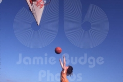 KID SHOOTS HOOP FROM STOOL © Jamie Budge, all right reserved