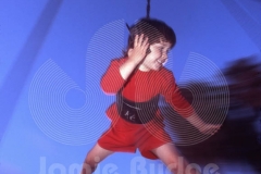 CELL PHONE KID ON SWING  © Jamie Budge, all rights reserved