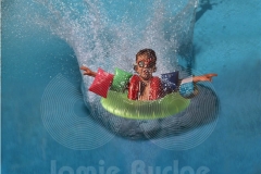 KID SPLASHES DOWN AFTER HIGH DIVE IN FULL FLOATATION © Jamie Budge, all right reserved