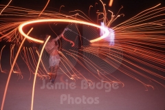 © Jamie Budge, All Rights Reserved.
FIREWORKS TWIRLING BEFORE THE BURN-THE-MAN PROCESSION.
NO RIGHTS Implied by posession of this CD.  Contact:
jamiebudge@windskate.com    (310) 453-4808