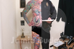 © Jamie Budge, all rights reserved.
TATTOO COP, KRISTIN ADAMS, HALF-IN AND HALF-OUT OF HIS UNIFORM, REVEALING HIS FULL BODY OF TATTOOS NEXT TO HIS TROPHIES AND "HARDWARE".
No Rights Implied by possession of this image.     Contact:
Jamie Budge (310) 453-4808  jamiebudge@windskate.com